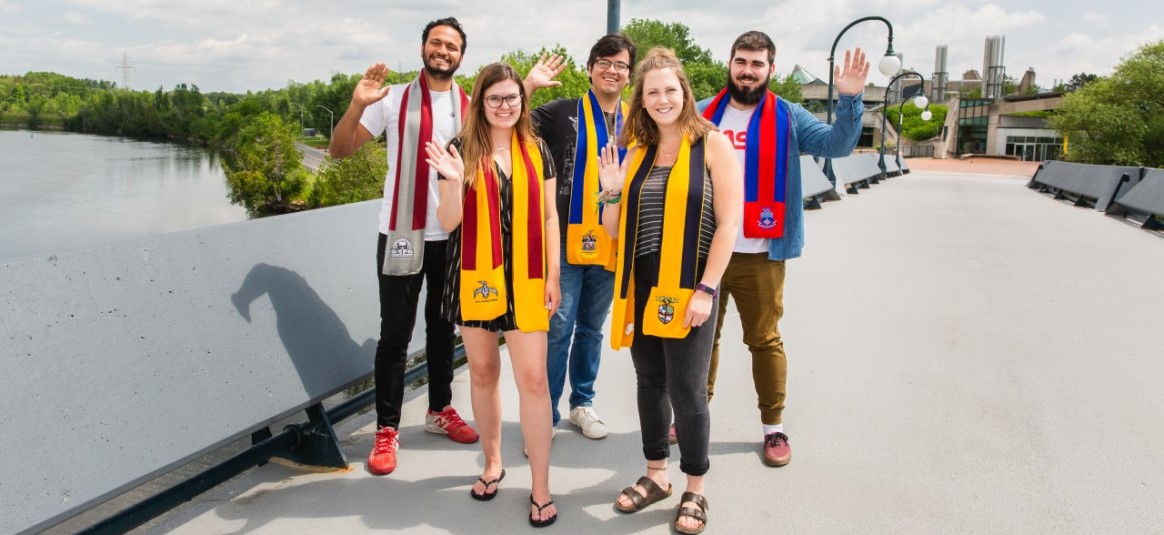Trent Students posing with their college scarf