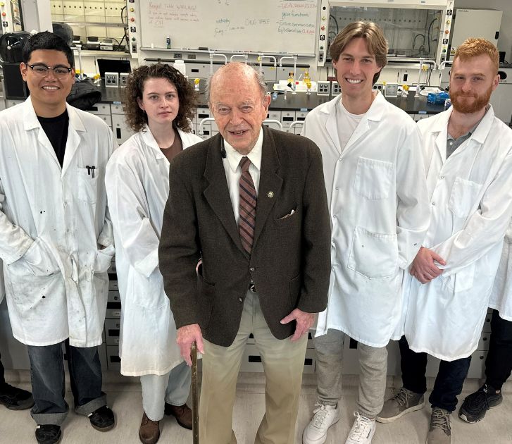 Professor Stairs with 6 students in the lab