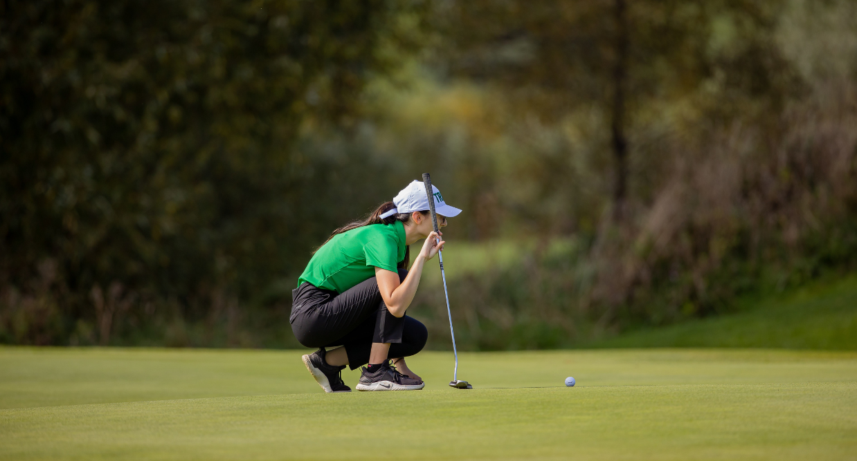 A girl playing golf